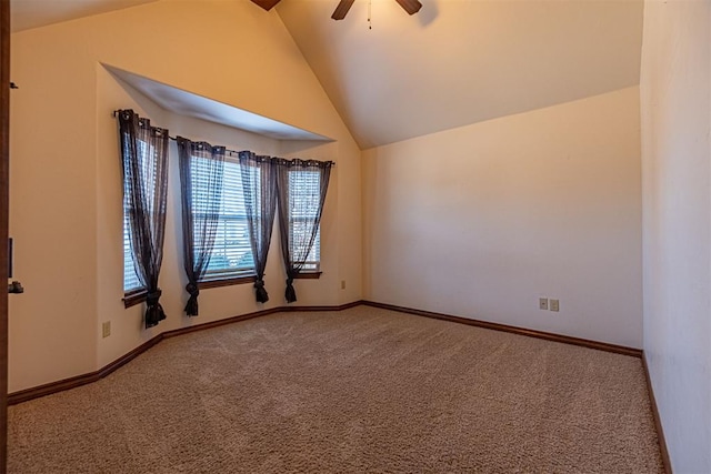 spare room featuring ceiling fan, high vaulted ceiling, and carpet floors