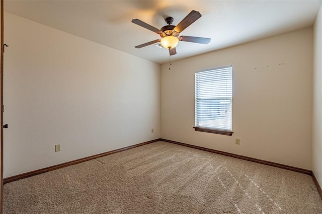 unfurnished room with carpet and ceiling fan