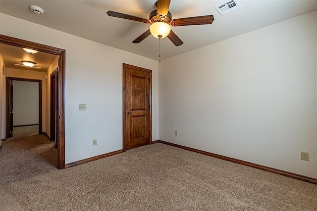 unfurnished bedroom with ceiling fan and carpet floors