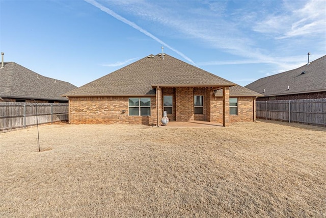 back of property with a patio