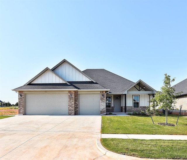 craftsman-style home with a garage and a front lawn