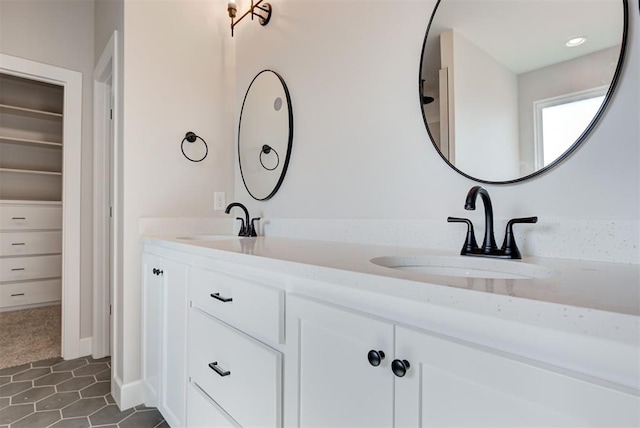 bathroom with vanity and tile patterned floors