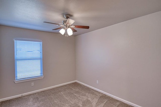 spare room with ceiling fan and carpet flooring