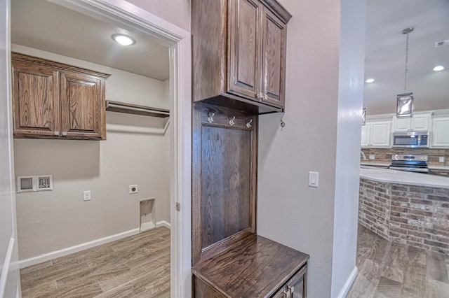 mudroom with wood-type flooring