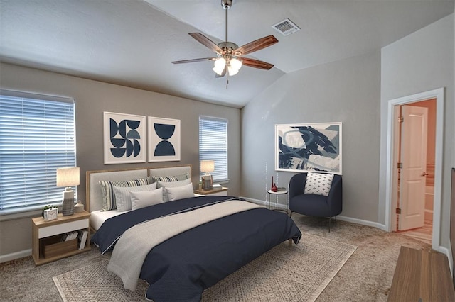 carpeted bedroom featuring vaulted ceiling and ceiling fan