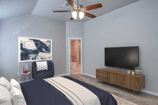 bedroom with ceiling fan, lofted ceiling, carpet flooring, and connected bathroom