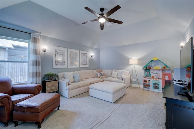 living room featuring lofted ceiling, light colored carpet, and ceiling fan