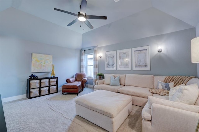 living room with ceiling fan, vaulted ceiling, and light carpet