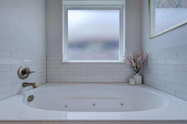 bathroom featuring a tub to relax in