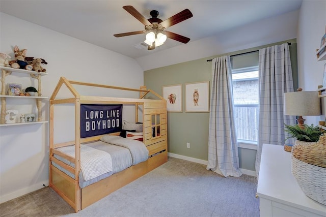 bedroom featuring vaulted ceiling, light carpet, and ceiling fan