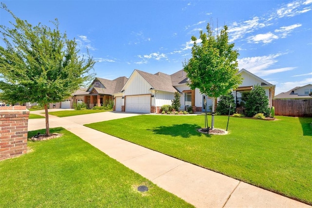 view of front facade with a garage and a front lawn