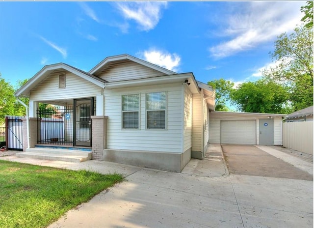 view of front of house with a garage and covered porch