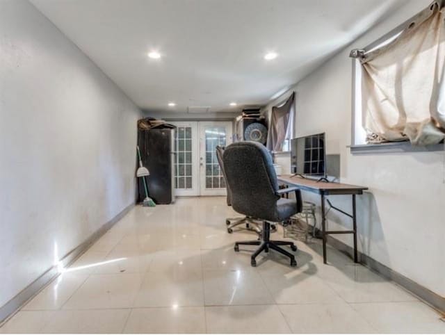 home office featuring light tile patterned floors and french doors