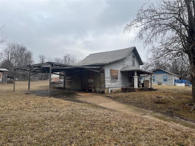 view of home's exterior featuring a carport