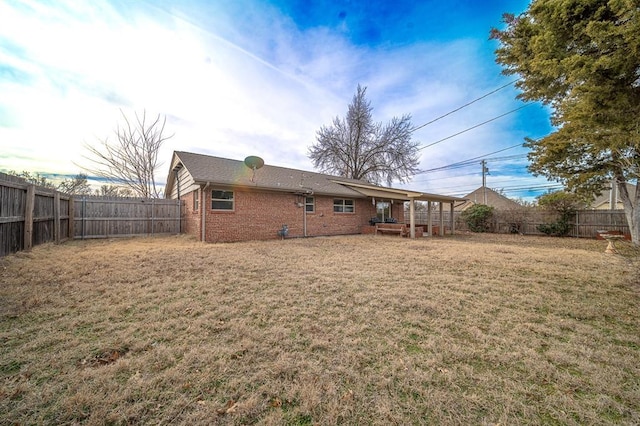 back of house with a yard