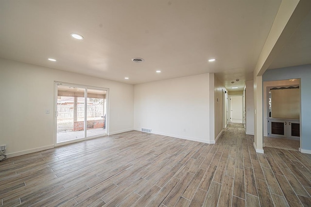 spare room featuring hardwood / wood-style flooring