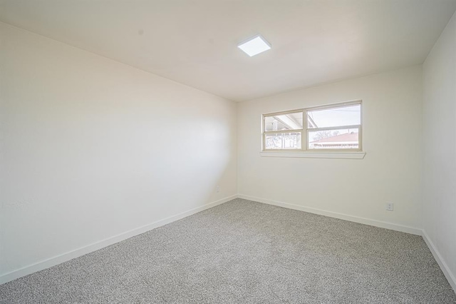 spare room featuring carpet flooring