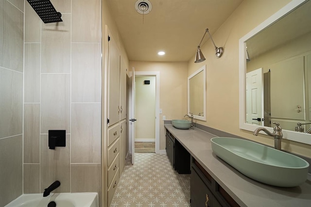 bathroom featuring shower / bath combination and vanity