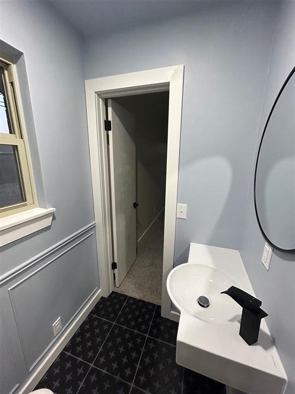 bathroom featuring tile patterned flooring