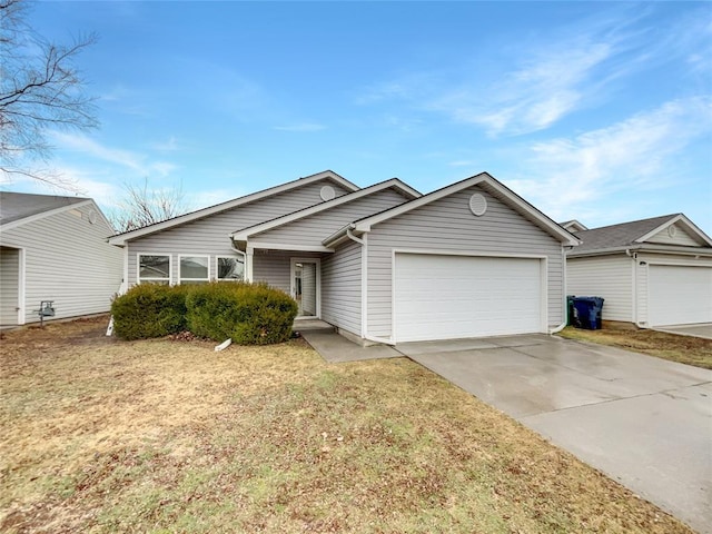 ranch-style house with a garage and a front lawn