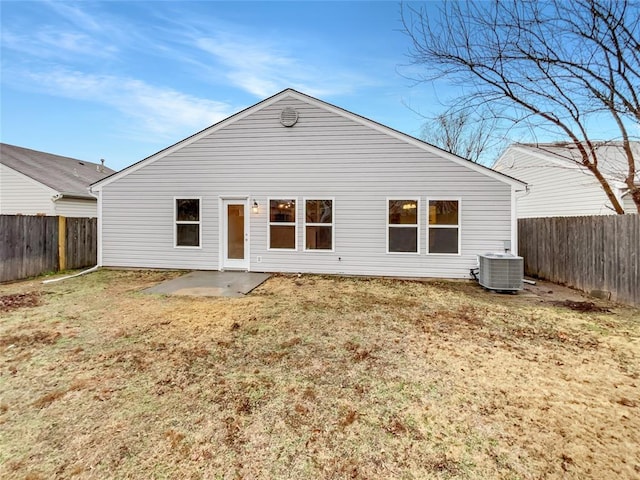 back of property with a patio, a yard, and central AC unit