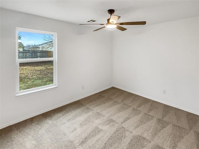 carpeted empty room with ceiling fan