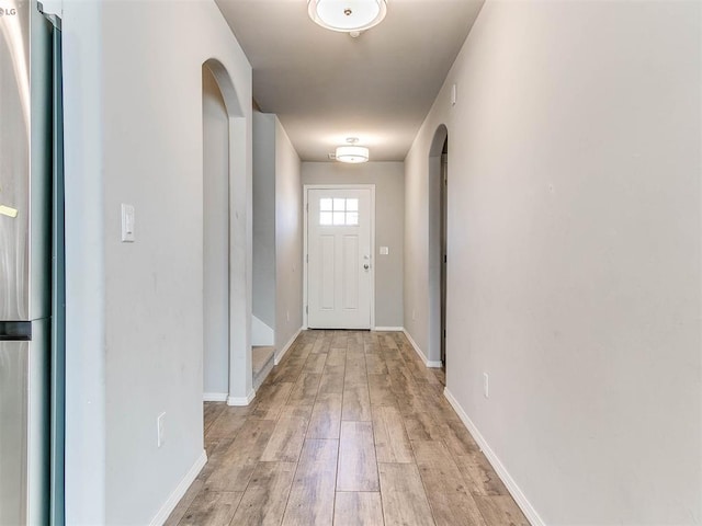 doorway with light hardwood / wood-style floors