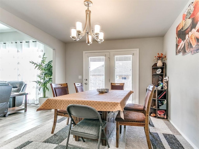 dining area featuring a chandelier