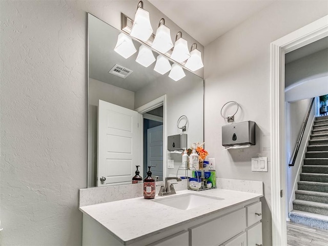 bathroom featuring vanity and wood-type flooring