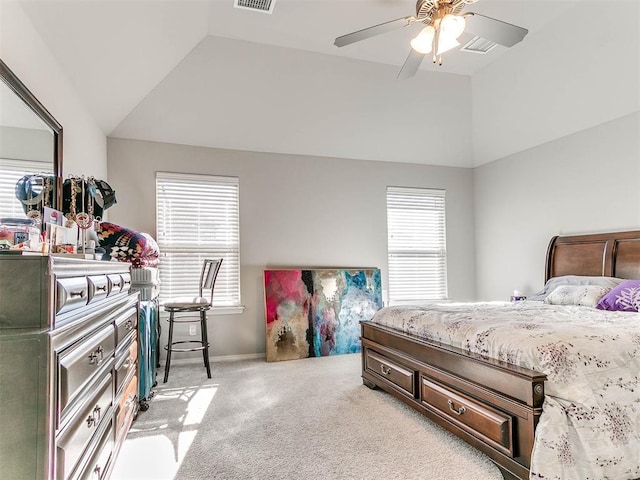 carpeted bedroom featuring lofted ceiling and ceiling fan