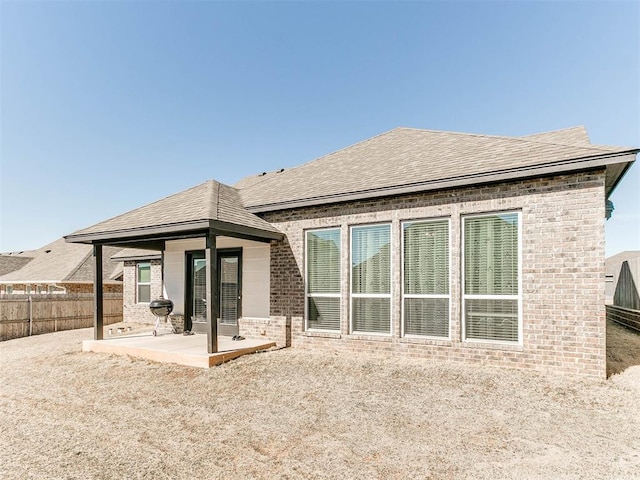 rear view of property featuring a patio