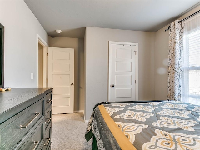 bedroom featuring light colored carpet