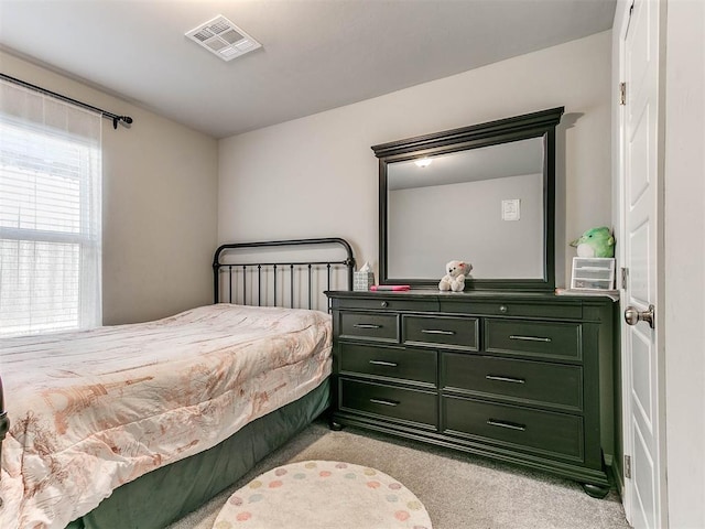 bedroom with light carpet