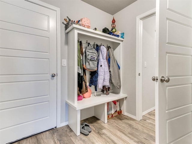 mudroom with light hardwood / wood-style flooring