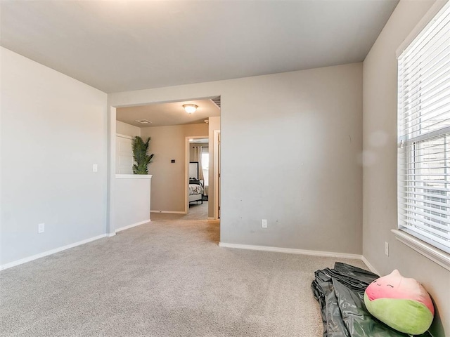 empty room with light colored carpet