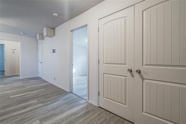 hallway featuring light hardwood / wood-style flooring