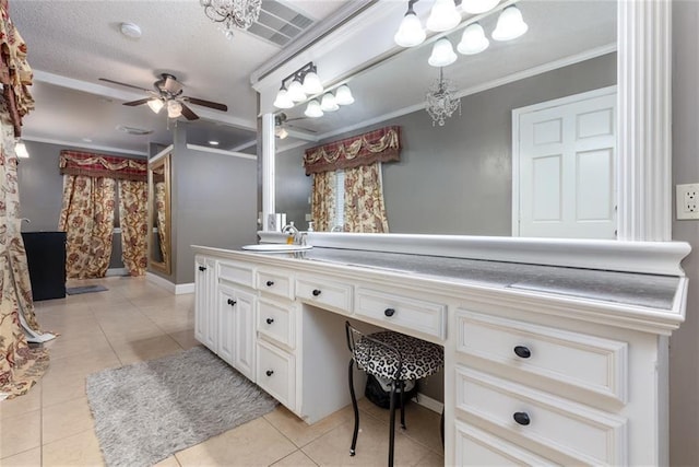 bathroom featuring crown molding, ceiling fan, vanity, a textured ceiling, and tile patterned floors