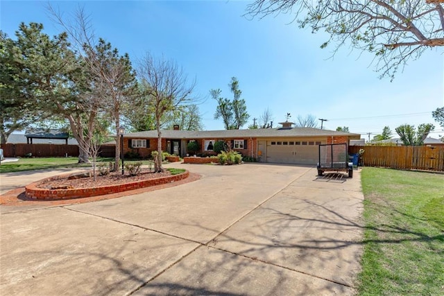 ranch-style home featuring a garage and a front yard