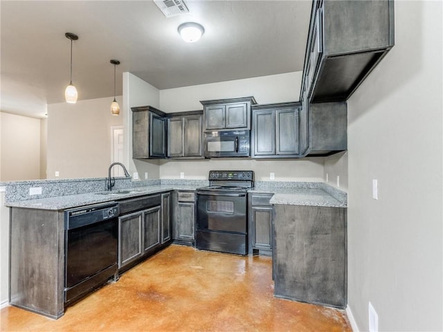 kitchen featuring sink, pendant lighting, light stone counters, and black appliances