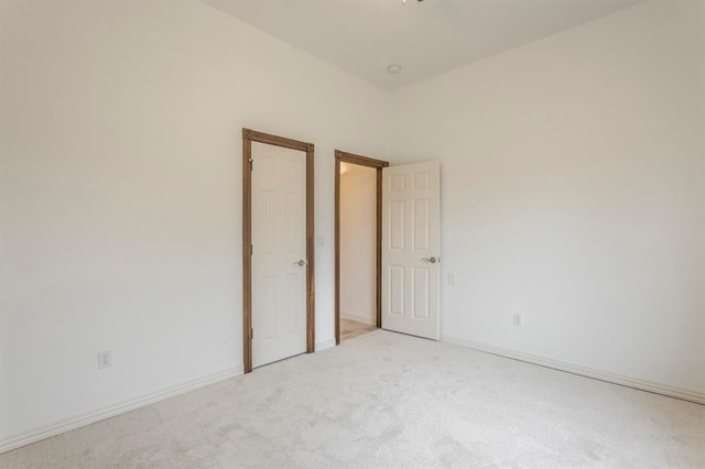 empty room featuring light colored carpet