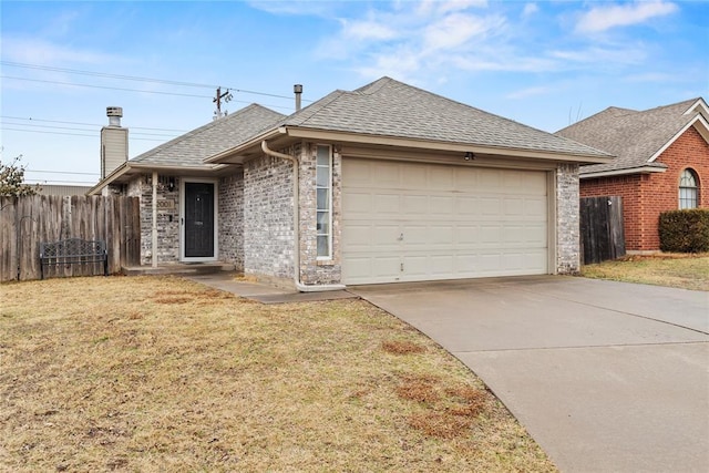 ranch-style house featuring a garage and a front yard