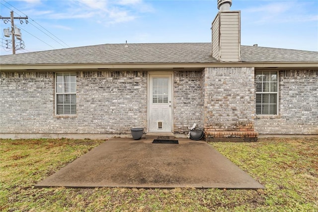 rear view of property with a patio area and a lawn