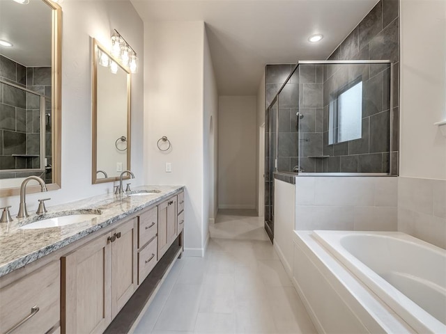 bathroom featuring vanity, shower with separate bathtub, and tile patterned flooring