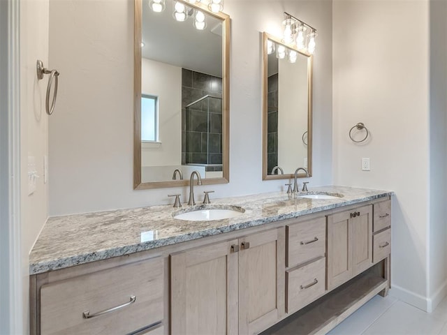 bathroom with tile patterned flooring and vanity