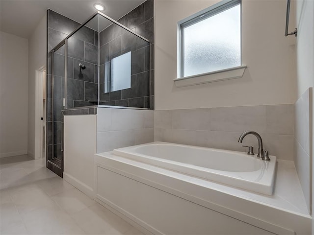 bathroom featuring separate shower and tub and tile patterned flooring