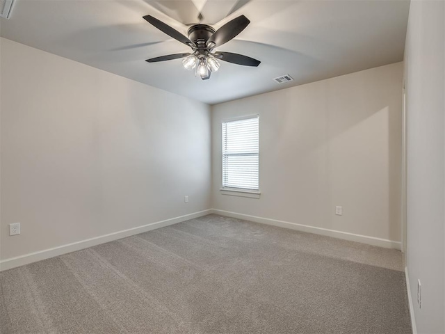 unfurnished room with ceiling fan and carpet floors