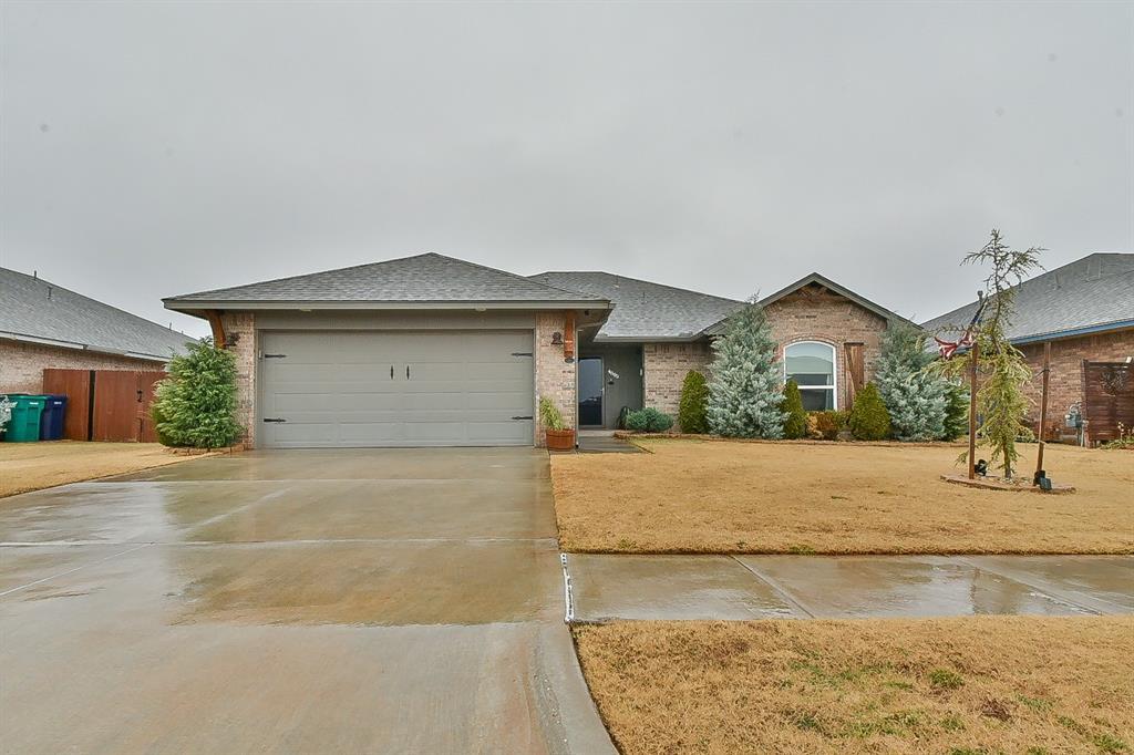 ranch-style house featuring a garage