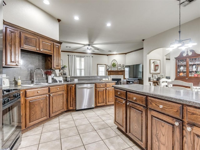 kitchen with pendant lighting, sink, dishwasher, gas stove, and ceiling fan with notable chandelier