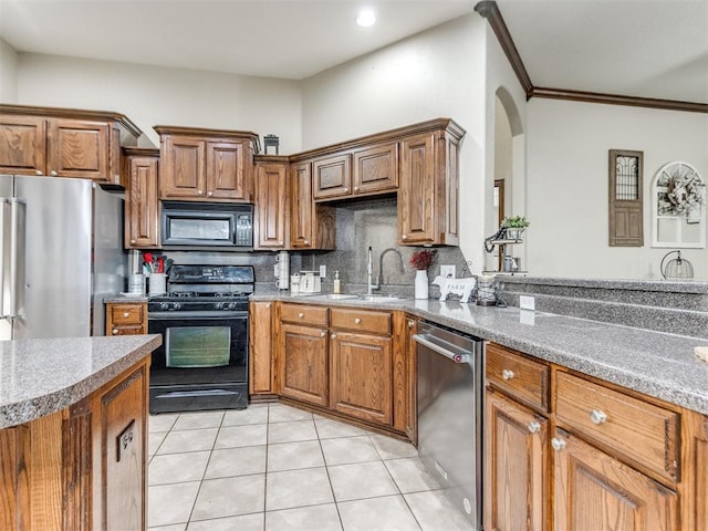 kitchen featuring sink, tasteful backsplash, ornamental molding, black appliances, and light tile patterned flooring