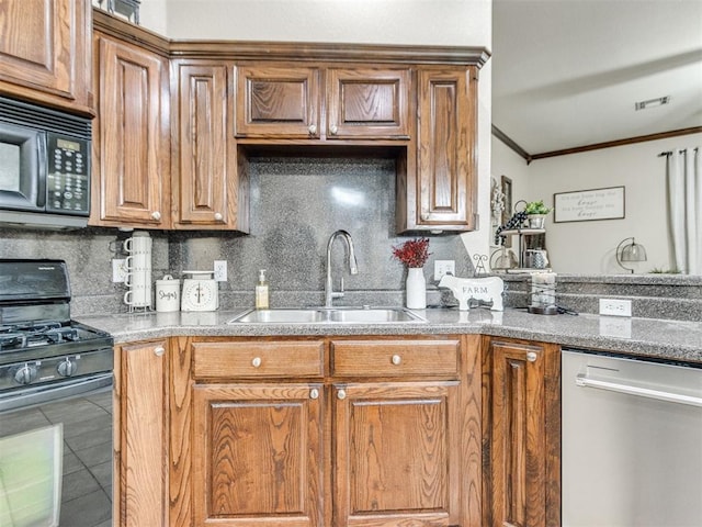 kitchen with sink, crown molding, black appliances, decorative backsplash, and dark stone counters